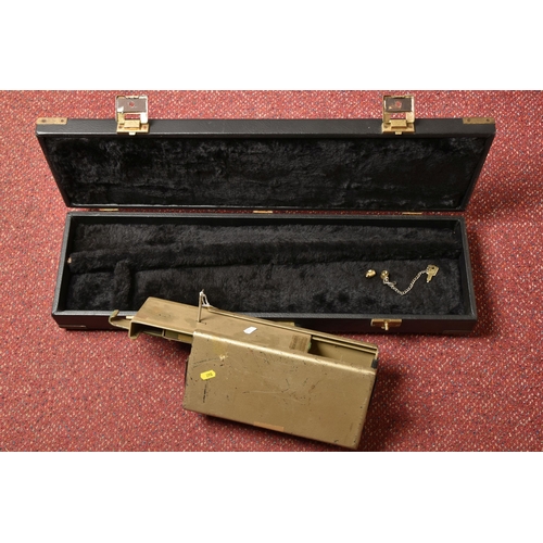 290 - A BLACK EBONISED SHOTGUN CASE AND A GUNMATE GUN KEEP, with brass banding and a furry padded interior... 