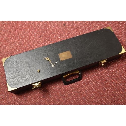 290 - A BLACK EBONISED SHOTGUN CASE AND A GUNMATE GUN KEEP, with brass banding and a furry padded interior... 