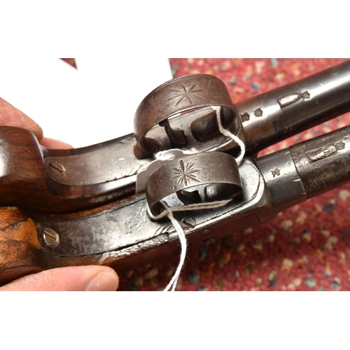 296 - TWO 19TH CENTURY FLINTLOCK POCKET PISTOLS, both with plain walnut grips, one marked Pritchard and fi... 