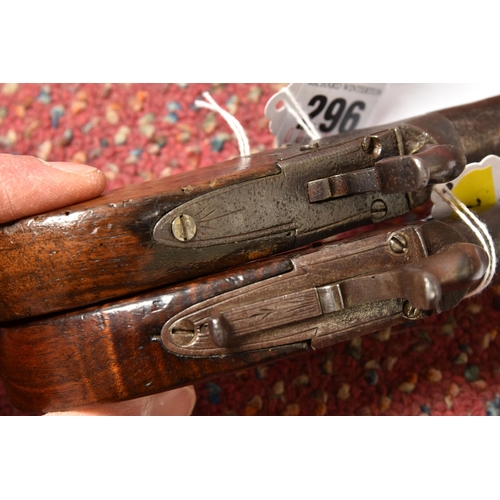 296 - TWO 19TH CENTURY FLINTLOCK POCKET PISTOLS, both with plain walnut grips, one marked Pritchard and fi... 