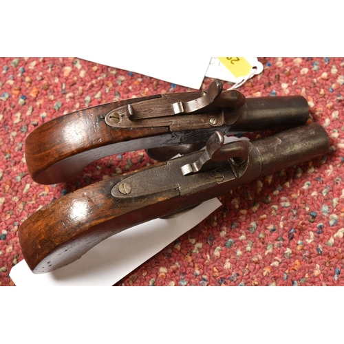 296 - TWO 19TH CENTURY FLINTLOCK POCKET PISTOLS, both with plain walnut grips, one marked Pritchard and fi... 