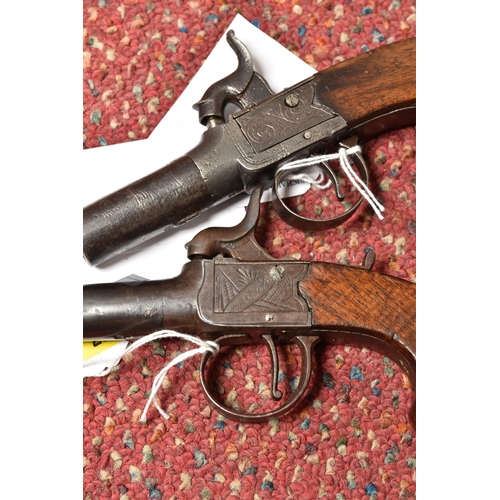 296 - TWO 19TH CENTURY FLINTLOCK POCKET PISTOLS, both with plain walnut grips, one marked Pritchard and fi... 