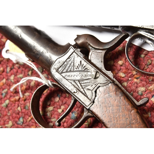 296 - TWO 19TH CENTURY FLINTLOCK POCKET PISTOLS, both with plain walnut grips, one marked Pritchard and fi... 