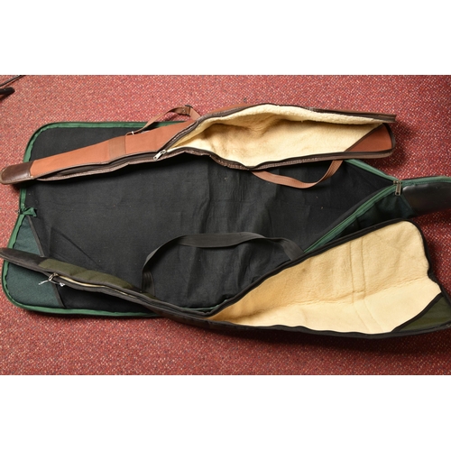 298 - A GUNLUGGA GREEN CANVAS AIR RIFLE CARRYING CASE, and two other air rifle carrying cases (3)