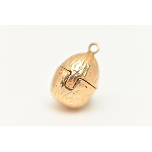 20 - A 9CT GOLD EGG AND CHICK CHARM, yellow gold egg with hinged fittings opening up to reveal an enamel ... 