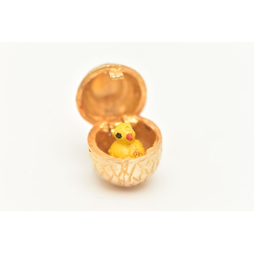 20 - A 9CT GOLD EGG AND CHICK CHARM, yellow gold egg with hinged fittings opening up to reveal an enamel ... 