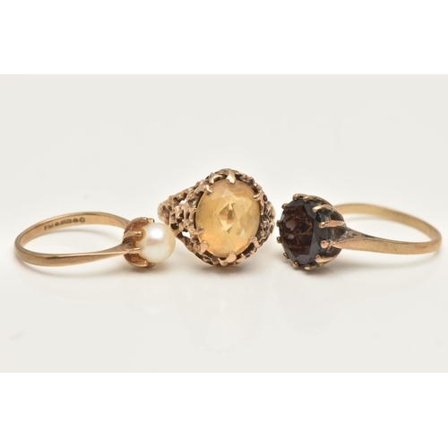 4 - THREE GEM SET RINGS, the first an oval cut Citrine, prong set in a yellow gold brutalist style mount... 