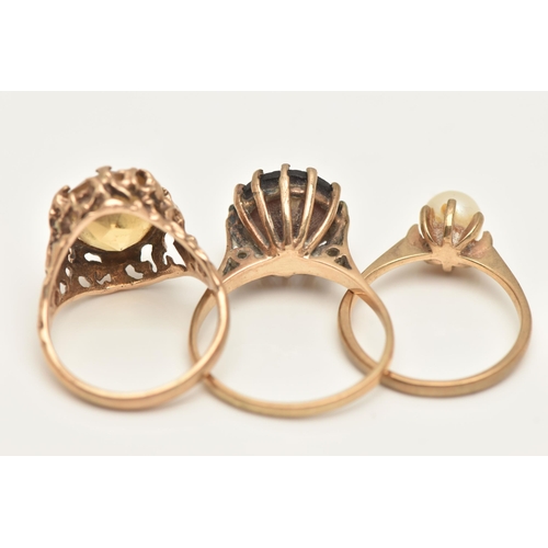 4 - THREE GEM SET RINGS, the first an oval cut Citrine, prong set in a yellow gold brutalist style mount... 