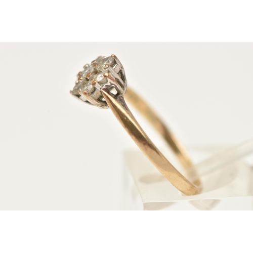 42 - A 9CT GOLD DIAMOND CLUSTER RING, flower shape cluster set with seven round brilliant cut diamonds, i... 