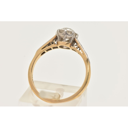 43 - A YELLOW METAL GEM SET RING, set with a colourless circular cut stone assessed as moissanite (heavil... 