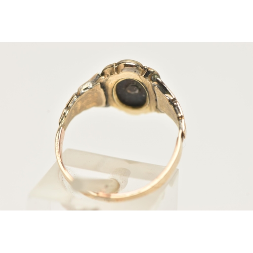 65 - A YELLOW METAL RING, a 19th century mourning ring set with a single seed pearl, unmarked, ring size ... 