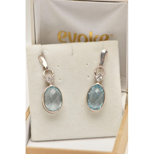 68 - A PAIR OF TOPAZ EARRINGS, faceted oval topaz stones collet set with square cut cubic zirconia accent... 