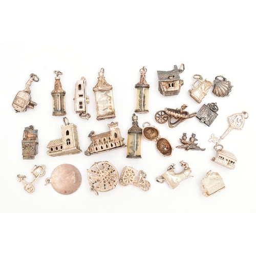 81 - ASSORTED WHITE METAL CHARMS, in various forms to include church, boots, houses, shell, tankard, St. ... 