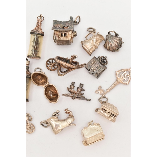 81 - ASSORTED WHITE METAL CHARMS, in various forms to include church, boots, houses, shell, tankard, St. ... 