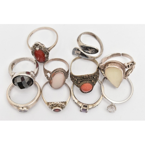 82 - AN ASSORTMENT OF TEN RINGS, to include one silver band ring set with a heart cut cubic zirconia, hal... 