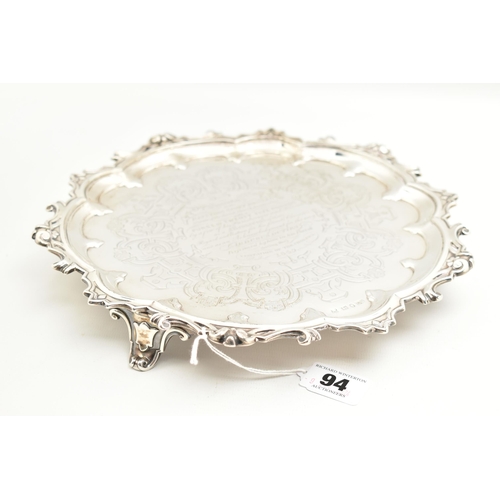 94 - A VICTORIAN SILVER PRESENTATION SALVER, circular form salver with scrolling detail to the rim, engra... 