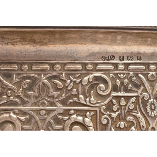 95 - AN EARLY 20TH CENTURY SILVER EMBOSSED TRAY, of a rectangular form with embossed design, vacant carto... 