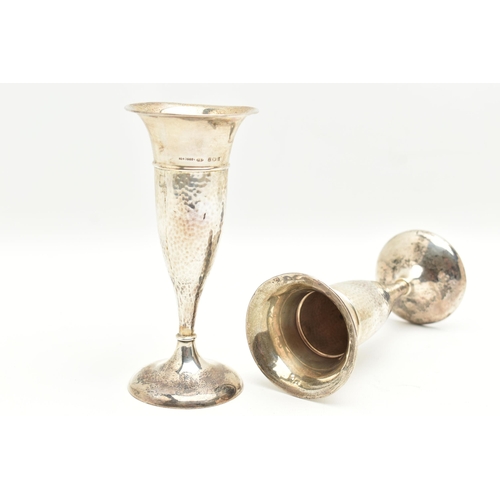 96 - A PAIR OF EARLY 20TH CENTURY SILVER POSY VASES, tapering form with hammer effect, on round weighted ... 