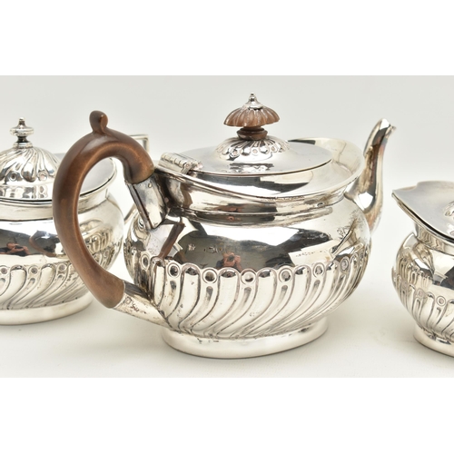 97 - A VICTORIAN THREE PIECE SILVER TEA SET, a tea pot, milk jug and lidded sugar pot, part lobed design ... 