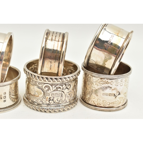 99 - AN ASSORTMENT OF SILVER NAPKIN RINGS, eight silver napkins all with varying designs, four hallmarked... 