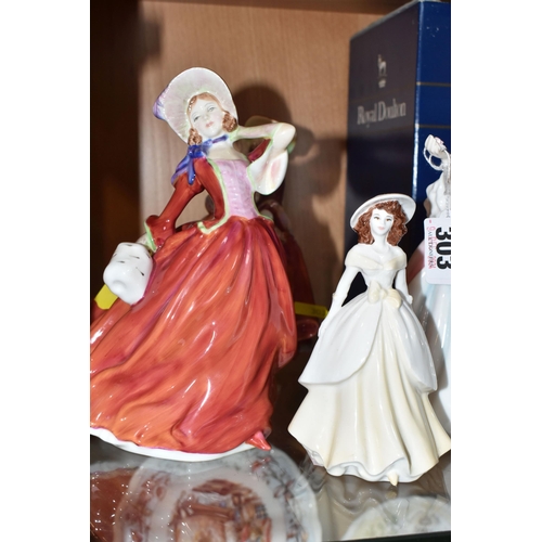 303 - A GROUP OF PORCELAIN FIGURINES to include three Royal Doulton figurines comprising a boxed 'Diana' H... 