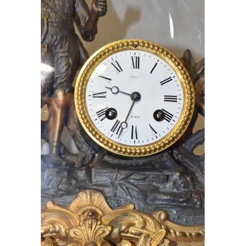 315 - A GLASS DOMED METAL MANTEL CLOCK comprising a gilded and bronzed metal figural mantel clock depictin... 