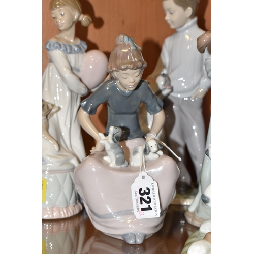 321 - A GROUP OF FIVE LLADRO AND NAO FIGURINES to include two Lladro figures comprising 'My Loyal Friend' ... 