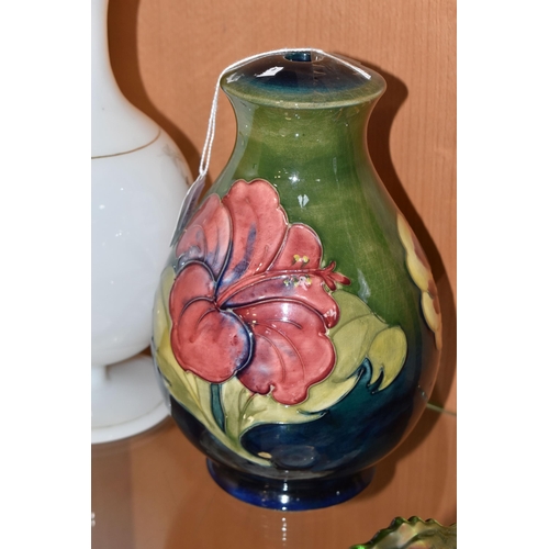 323 - A MOORCROFT POTTERY 'HIBISCUS' PATTERN LAMP BASE, together with a transfer printed milk glass vase, ... 