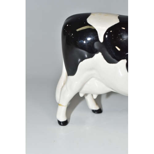 338 - A BESWICK FRIESIAN COW, Champion Claybury Leegwater model no 1362A (1) (Condition Report: has a repa... 