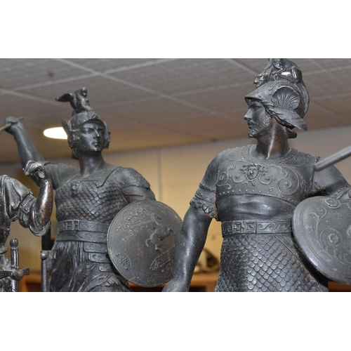 391 - FOUR METAL FIGURES AND A PAIR OF MANTEL VASES, comprising of a pair of warrior style spelter figures... 