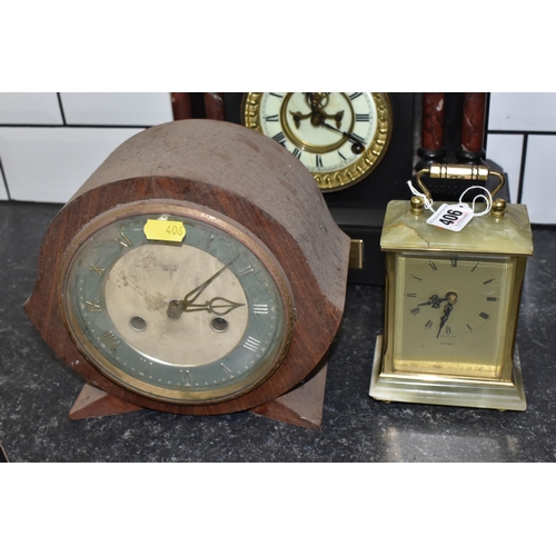 406 - A GROUP OF FOUR VINTAGE CLOCKS to include a black 'Ansonia' slate clock with a brass dedication plaq... 