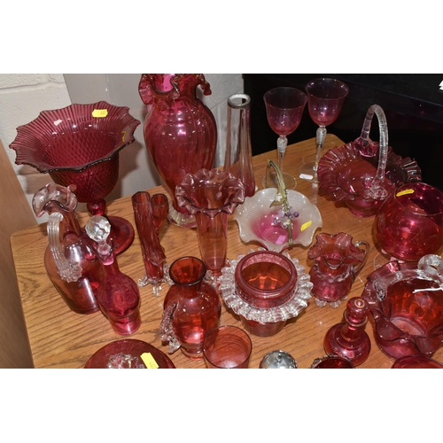 407 - A COLLECTION OF TWENTY-SIX CRANBERRY GLASS ITEMS to include a pair of wine glasses, three baskets (o... 