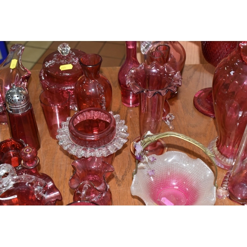 407 - A COLLECTION OF TWENTY-SIX CRANBERRY GLASS ITEMS to include a pair of wine glasses, three baskets (o... 