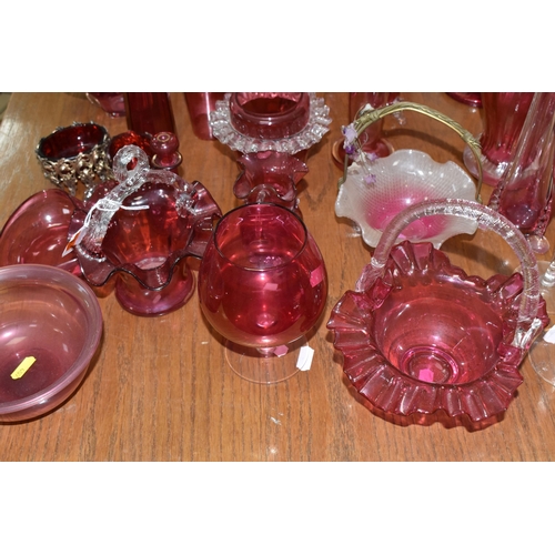 407 - A COLLECTION OF TWENTY-SIX CRANBERRY GLASS ITEMS to include a pair of wine glasses, three baskets (o... 