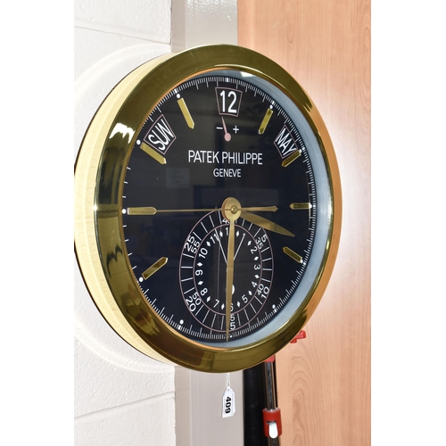 409 - A  'DISPLAY CLOCK' printed 'Patek Philippe', with a dark blue printed background with printed day, d... 