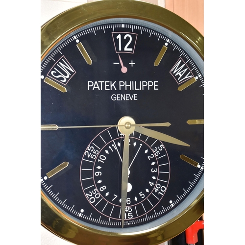 409 - A  'DISPLAY CLOCK' printed 'Patek Philippe', with a dark blue printed background with printed day, d... 