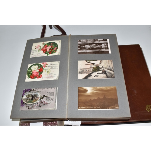 467 - TWO ALBUMS OF POSTCARDS containing approximately 609 examples, mostly from the early 20th century, s... 