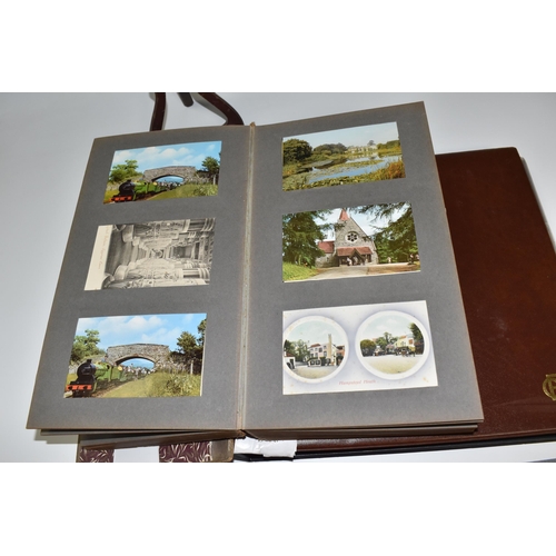 467 - TWO ALBUMS OF POSTCARDS containing approximately 609 examples, mostly from the early 20th century, s... 