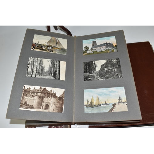 467 - TWO ALBUMS OF POSTCARDS containing approximately 609 examples, mostly from the early 20th century, s... 