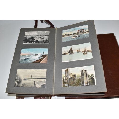 467 - TWO ALBUMS OF POSTCARDS containing approximately 609 examples, mostly from the early 20th century, s... 