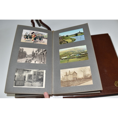 467 - TWO ALBUMS OF POSTCARDS containing approximately 609 examples, mostly from the early 20th century, s... 