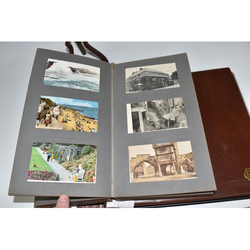 467 - TWO ALBUMS OF POSTCARDS containing approximately 609 examples, mostly from the early 20th century, s... 