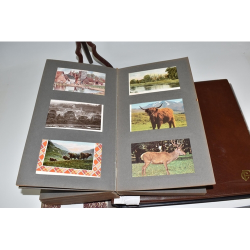 467 - TWO ALBUMS OF POSTCARDS containing approximately 609 examples, mostly from the early 20th century, s... 