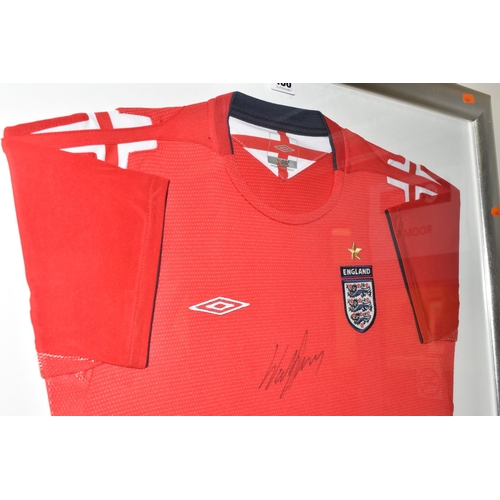 486 - A FRAMED ENGLAND FOOTBALL SHIRT, bearing signature, an official Umbro product red England Away footb... 