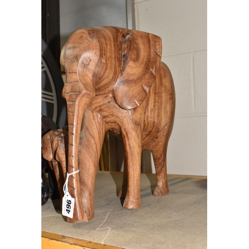 496 - THREE CARVED WOODEN ELEPHANTS, comprising a mother and baby, height 34cm, a vintage ebonised male el... 