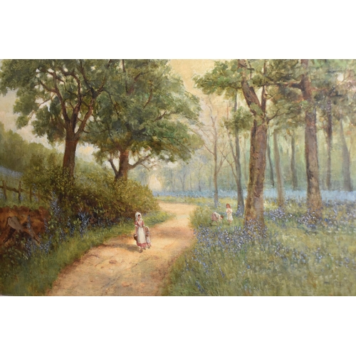 507 - SAMUEL LAWSON BOOTH R.C.A  (1836-1928) 'THE BLUEBELL WOODS', a young woman and child are walking alo... 