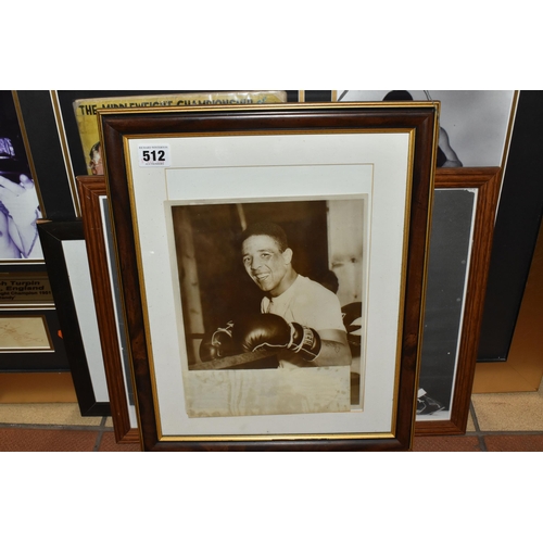 512 - SEVEN FRAMED PHOTOGRAPHS OF THE BOXER RANDOLPH TURPIN, including a collage of two photographs, an au... 