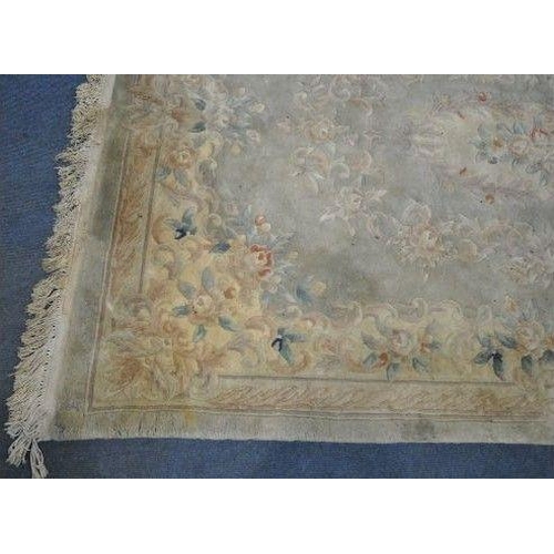 1197 - A LARGE RECTANGULAR CHINESE WOOLLEN RUG, 282cm x 180cm (condition report: has a few tassels missing ... 