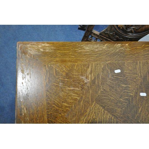 1199 - A 20TH CENTURY OAK DRAW LEAF BRETON TABLE, with a scrolled and wavy apron, raised on male and female... 