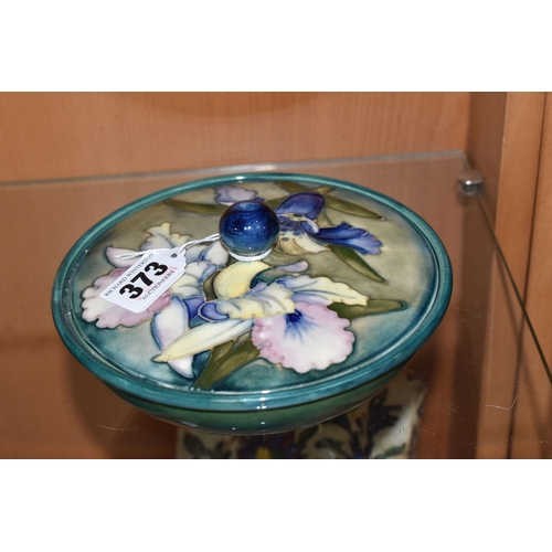 373 - A MOORCROFT POTTERY 'ORCHID' PATTERN COVERED BOWL, tube lined with blue and purple orchids on a grad... 